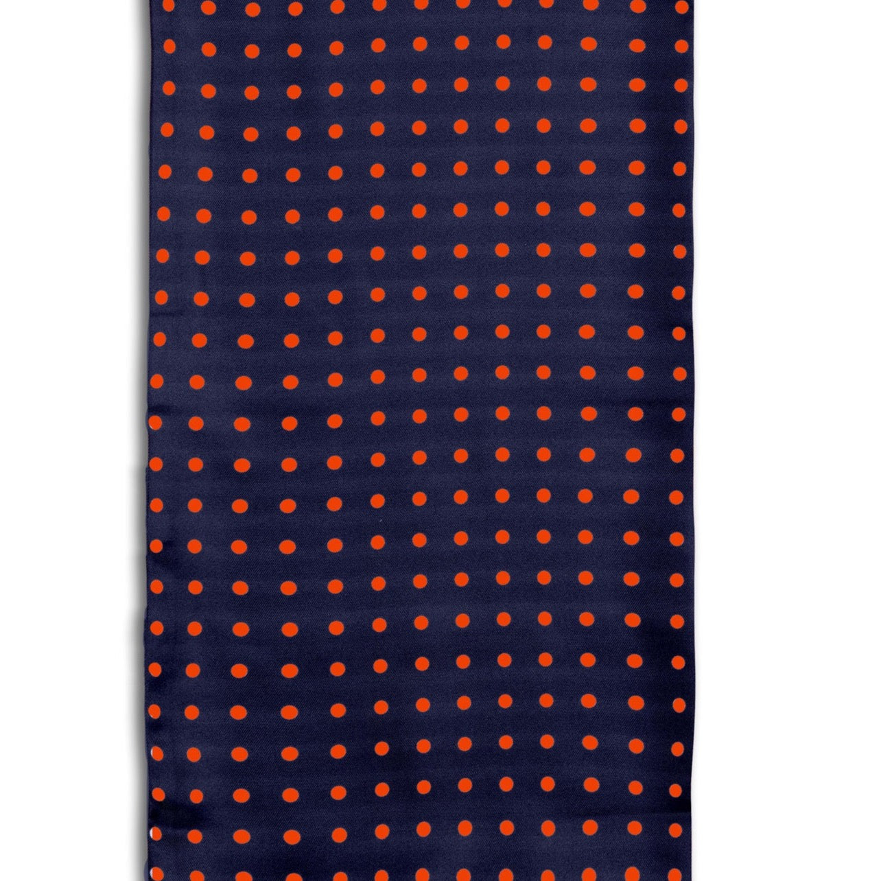 Close-up view of 'The Grand' polka-dot polyester scarf arranged in a rectangular shape, clearly showing the navy coloured fabric with red dots.