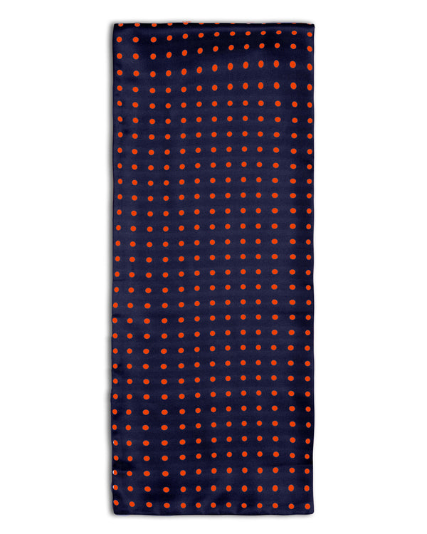 The Grand' polka-dot polyester scarf arranged in a rectangular shape, clearly showing the navy coloured fabric with red dots.