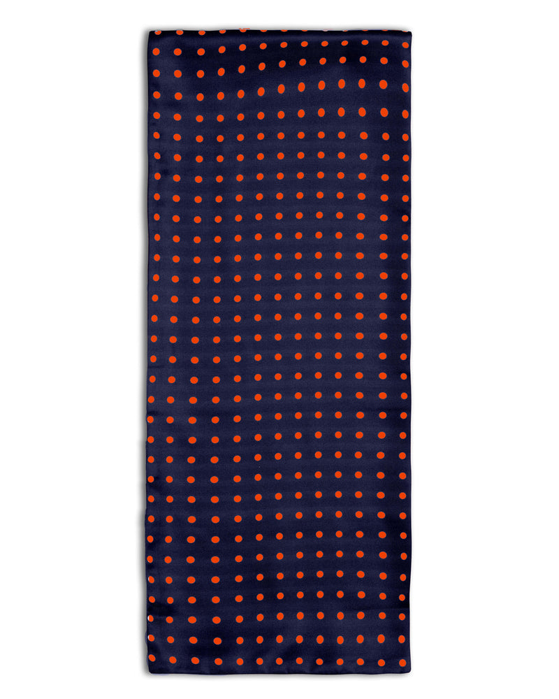 'The Grand' polka-dot polyester scarf arranged in a rectangular shape, clearly showing the navy coloured fabric with red dots.