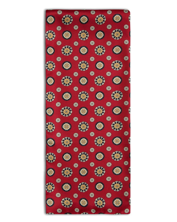 'The Montmartre' geometric deep red polyester scarf arranged in a rectangular shape, clearly showing the multi-coloured fabric.