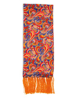 'Ocala' aviator scarf arranged in a rectangle shape with blue, orange, pink and brown paisley-like patterns with 3 inch orange fringe.