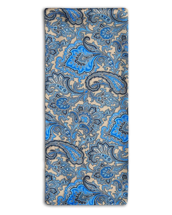 'The Piccadilly' polyester scarf folded in a rectangular shape with dark, mid and light blue paisley patterns.