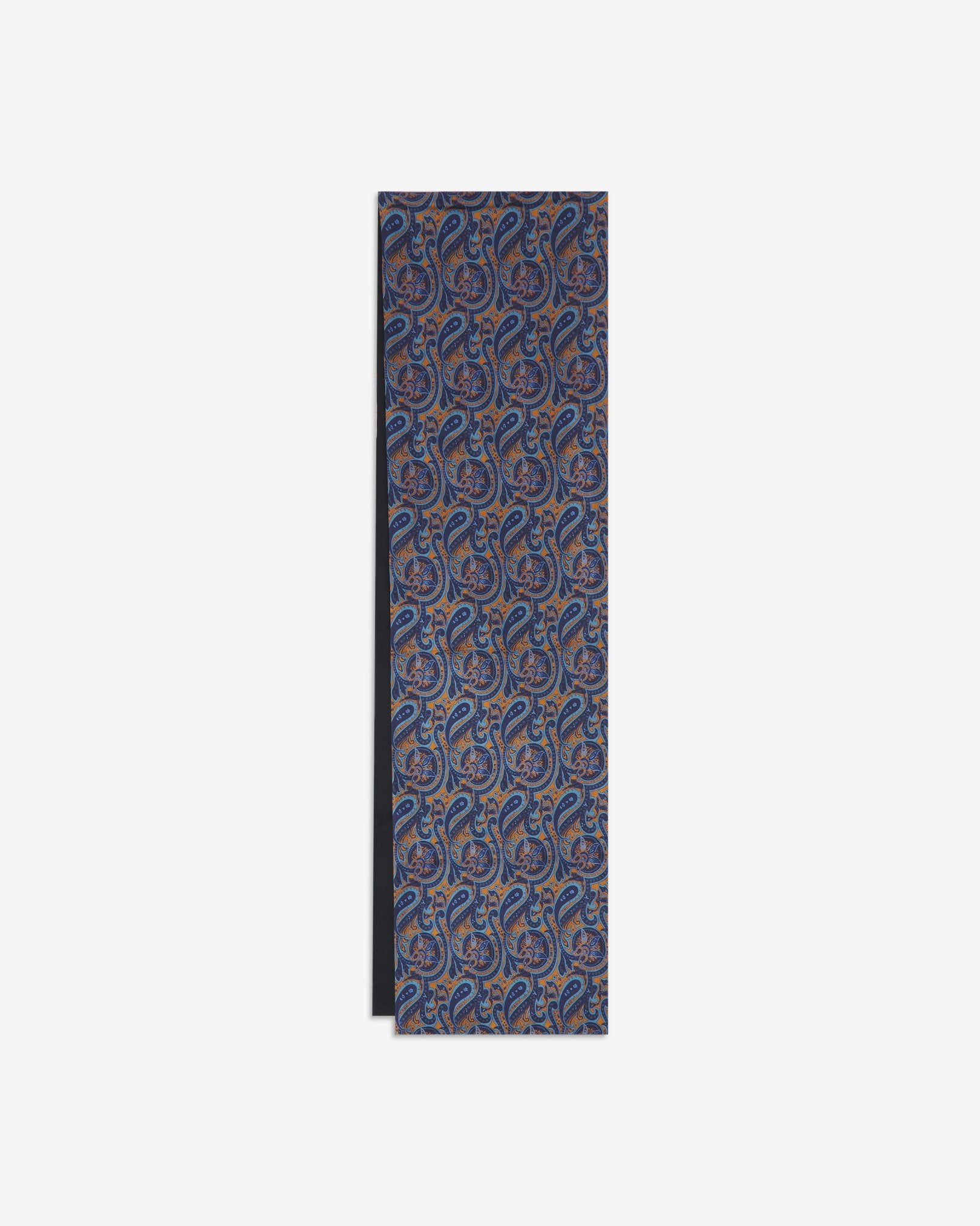 The Roppongi dress scarf arranged in a rectangular shape with a focus on the blue paisley patterns complemented by pale blue and orange highlights.