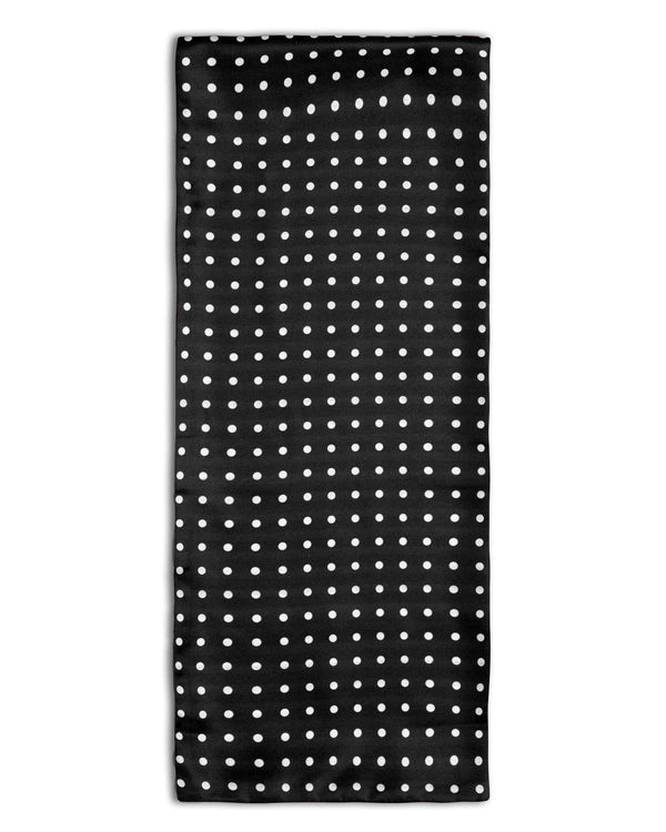 'The Shinagwa' polka-dot polyester scarf arranged in a rectangular shape, clearly showing the black fabric with white dots.