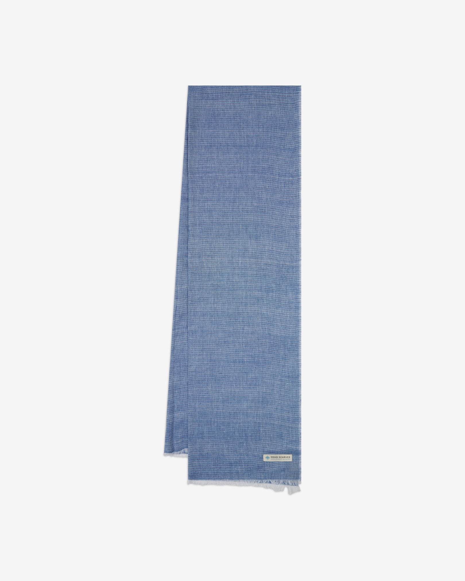 The 'MacArthur' scarf arranged in a rectangle shape, clearly showing the scarf dimensions, mid-blue fabric with a subtle pinstripe effect, and SOHO Scarves branding logo.