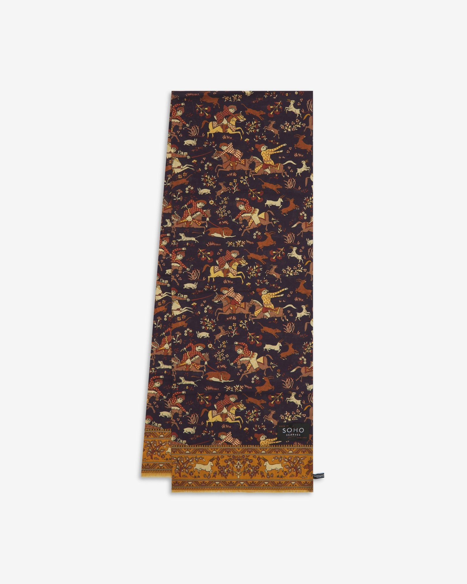 English-made silk and wool scarf arranged in a rectangular shape, displaying the repeating multicoloured hunting scenes in a range of autumnal tones and dill-gold eyelash fringing.