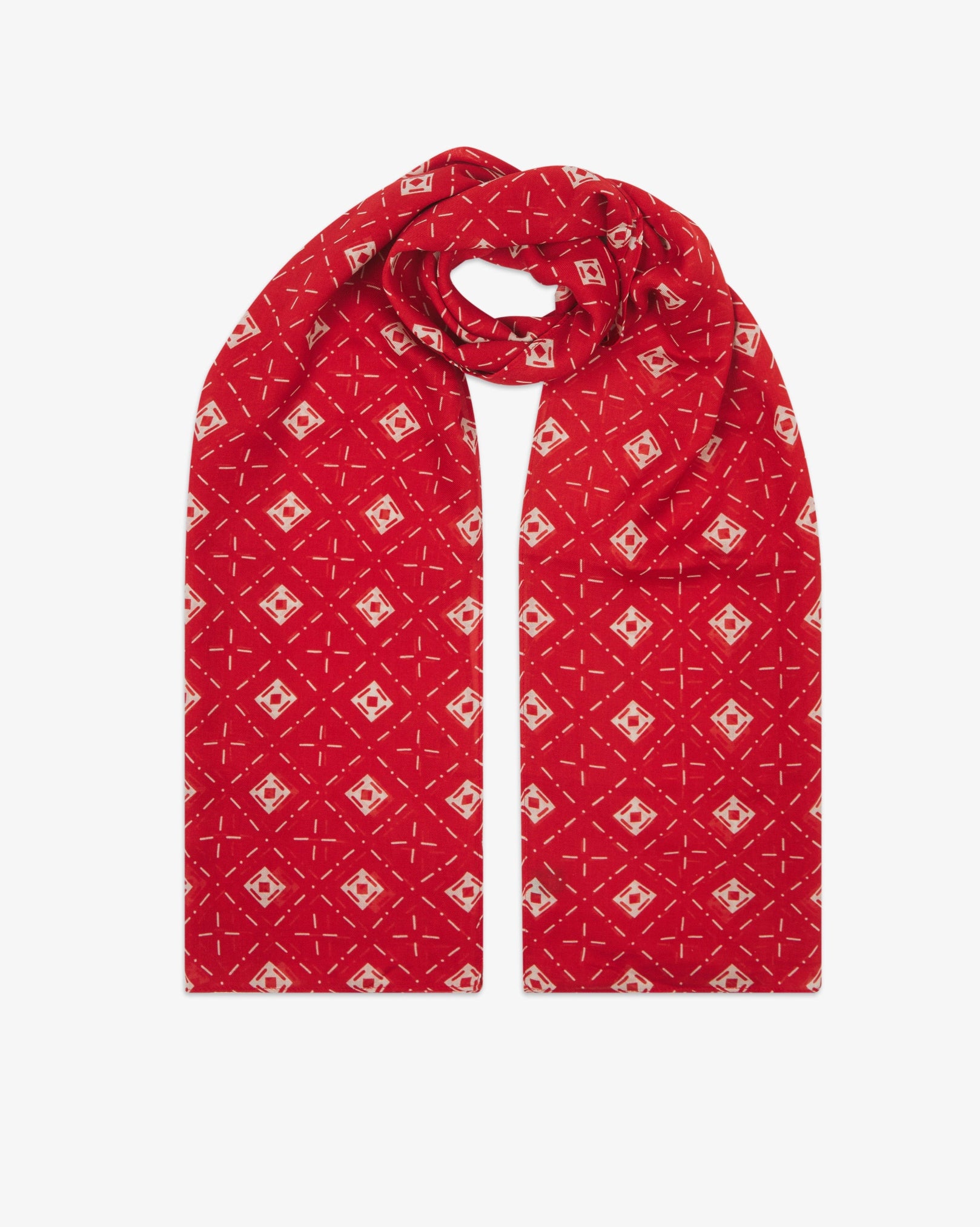The 'Diamonds' red bohemian wide scarf looped with both ends parallel, showcasing an ordered diamond mosaic of white lozenges and crosshair motifs on a bright red background across the soft modal and wool blend fabric.