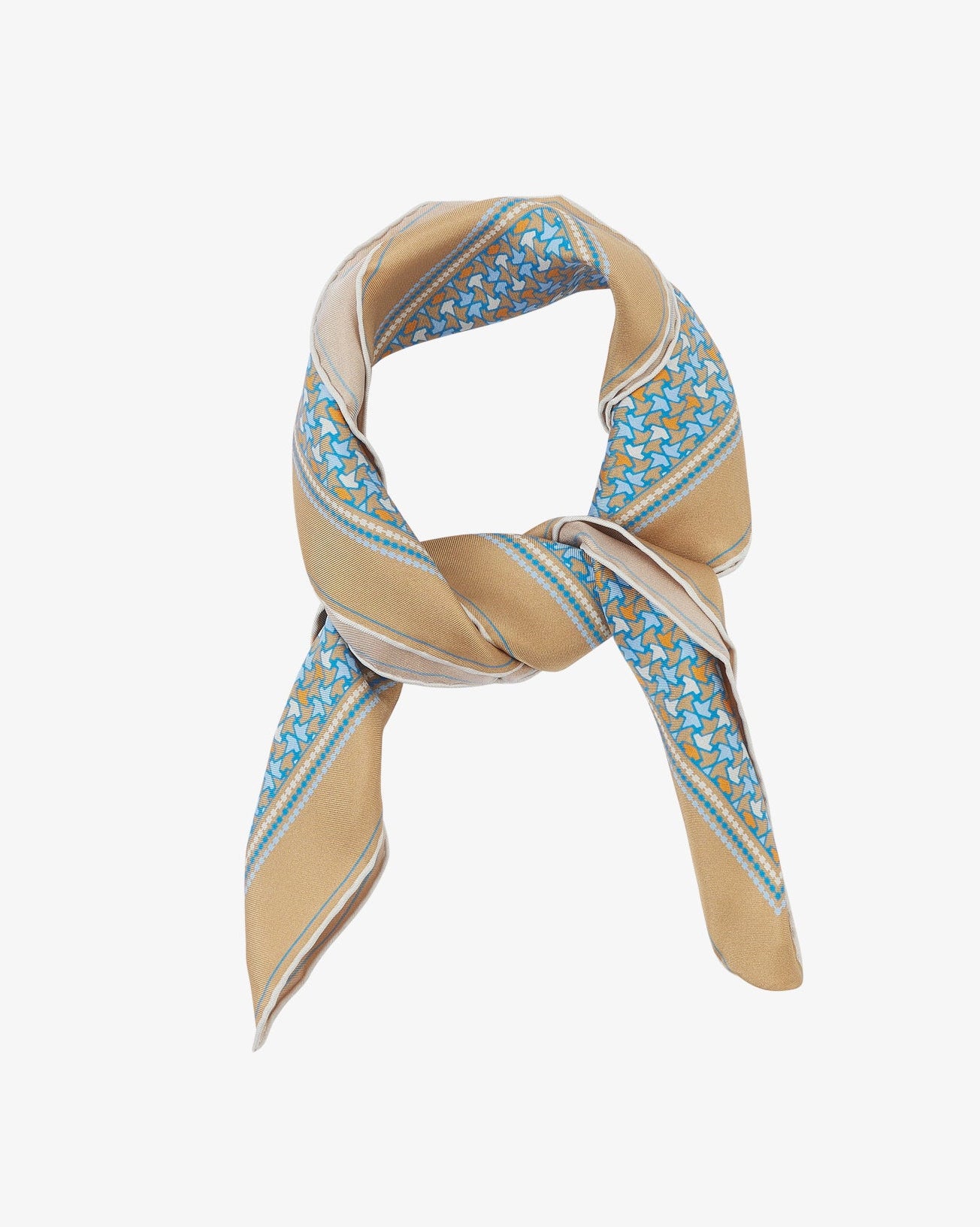 The 'Richmond' neckerchief looped and knotted, showcasing the golden-beige silk background with a delicate border of blue and orange leaf motifs.