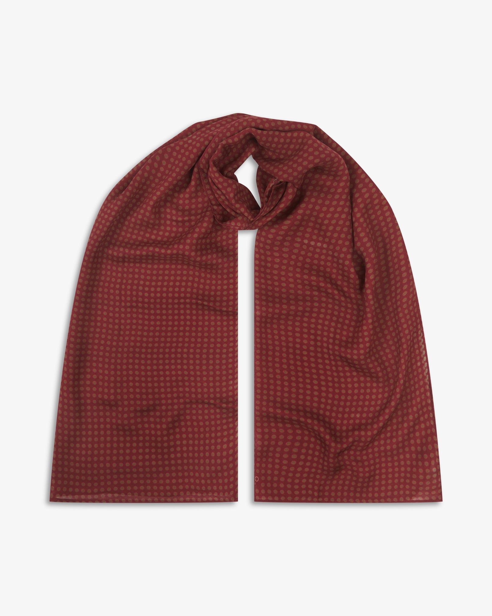 The Skytree 'Good Fortune' bohemian wide scarf looped with both ends parallel, showcasing neat rows of small concentric disc motifs in green and pink on a rich maroon background across the soft modal and wool blend fabric.