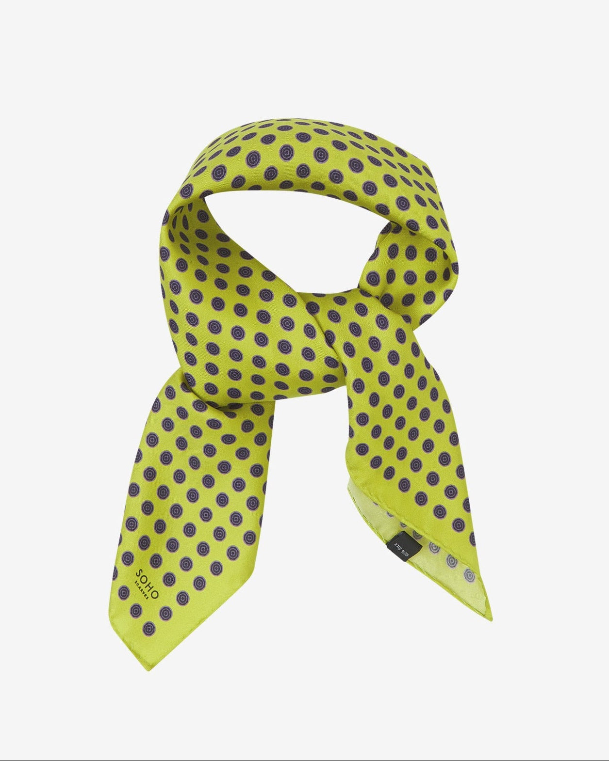 The 'Skytree Lime' neckerchief looped and knotted, presenting the dark disc pattern against the sheen of the fine silk material.