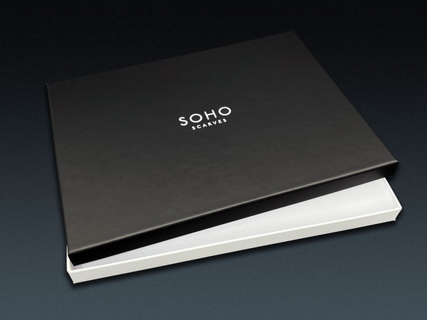Large deluxe SOHO Scarves gift box. Black branded lid dislodged to reveal white inner box.