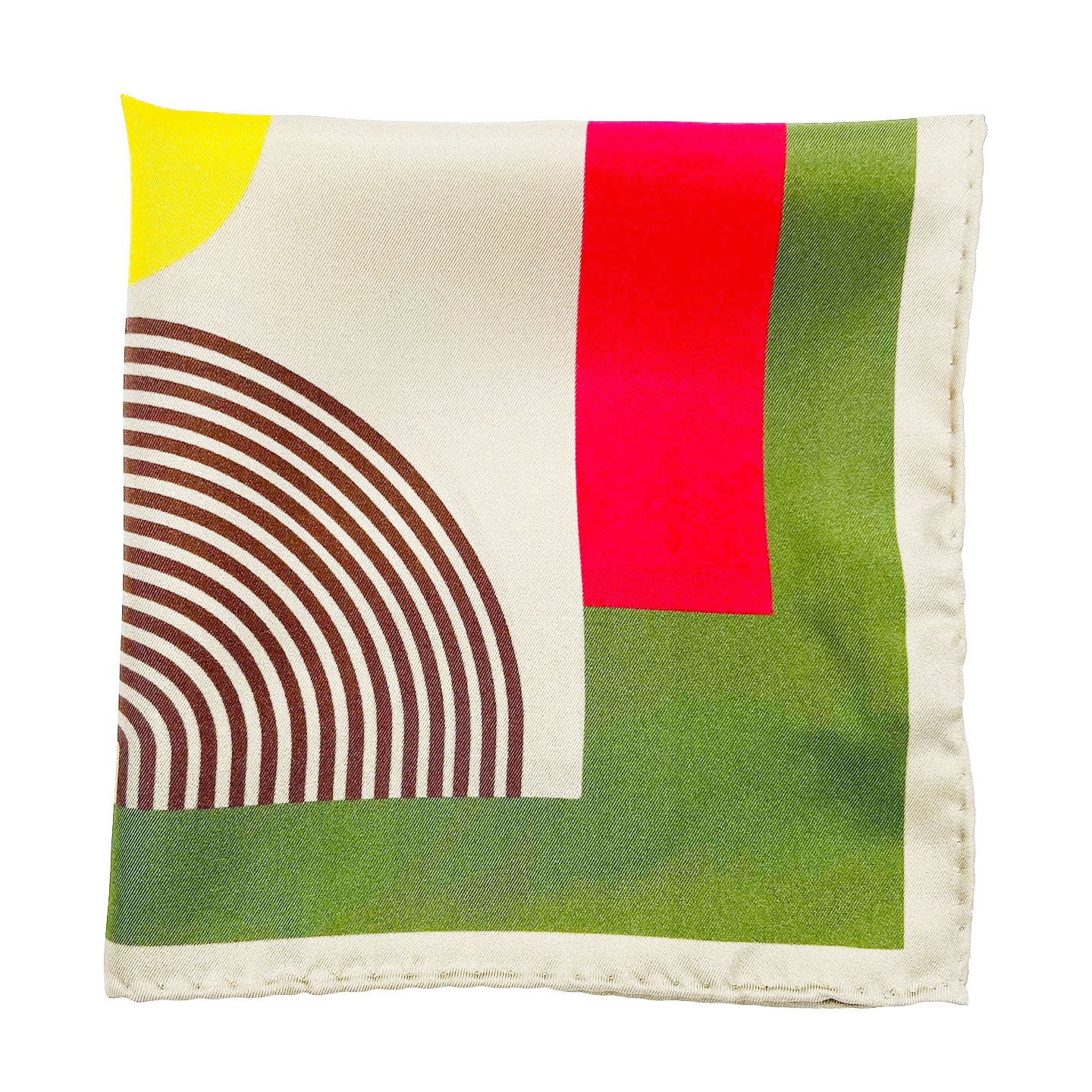 The 'Tay' silk pocket square from SOHO Scarves folded into a quarter, showing the retro geometric pattern and cream-coloured border.