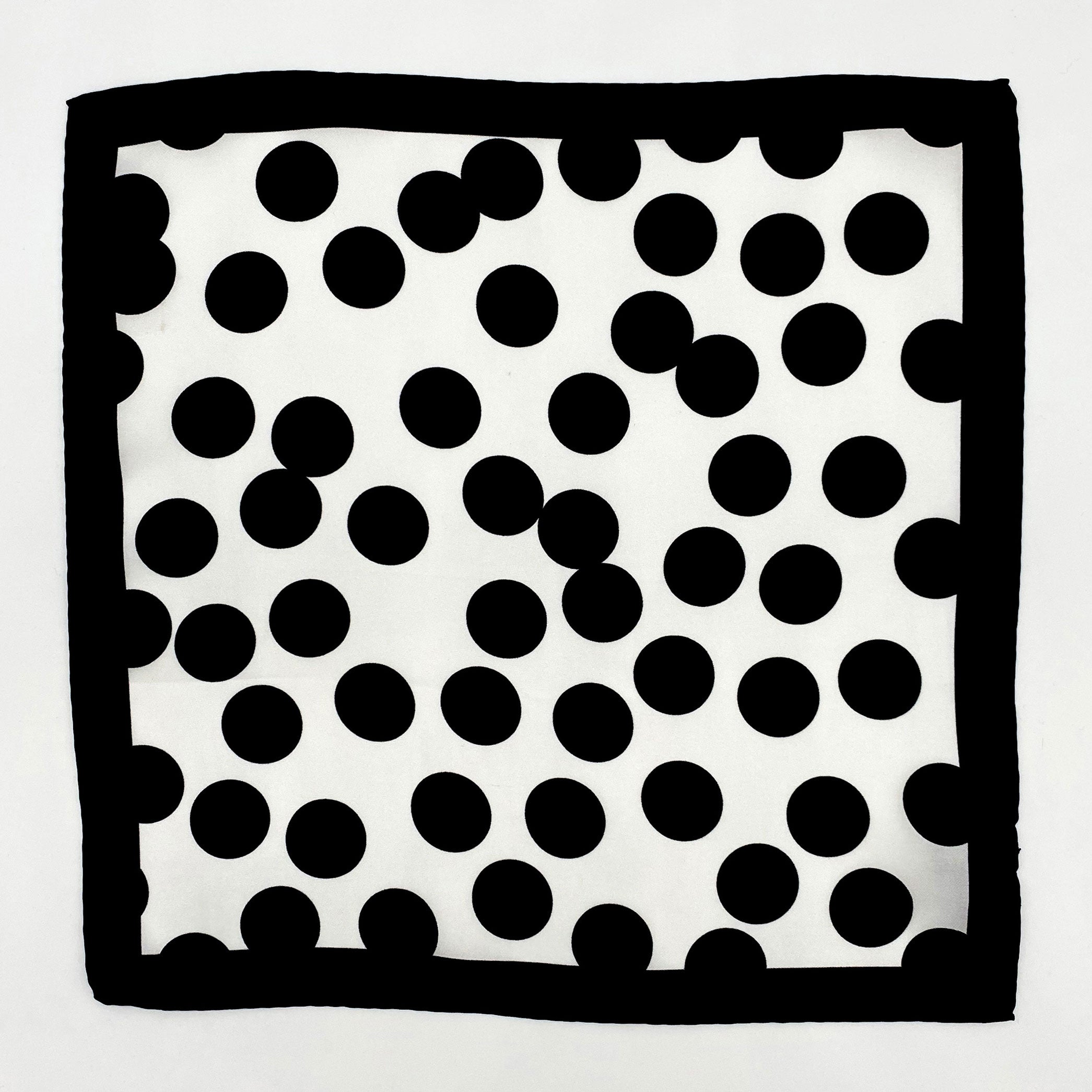 Completely unfolded monochrome silk pocket square showing the entirity of the polka-dot patterns and black border.