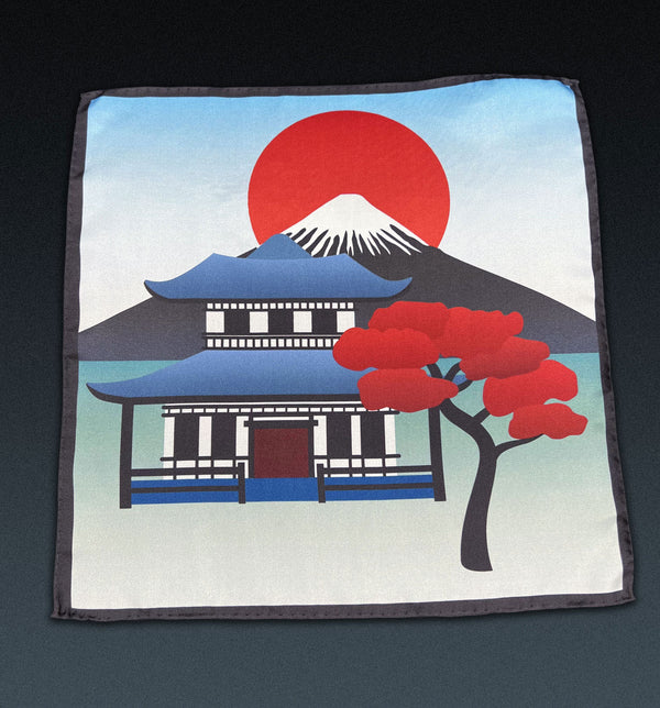 Unfolded 'House' pocket square in pure silk. Showing the full pattern with Japanese iconic symbolism. Red, green and blue with a charcoal frame.