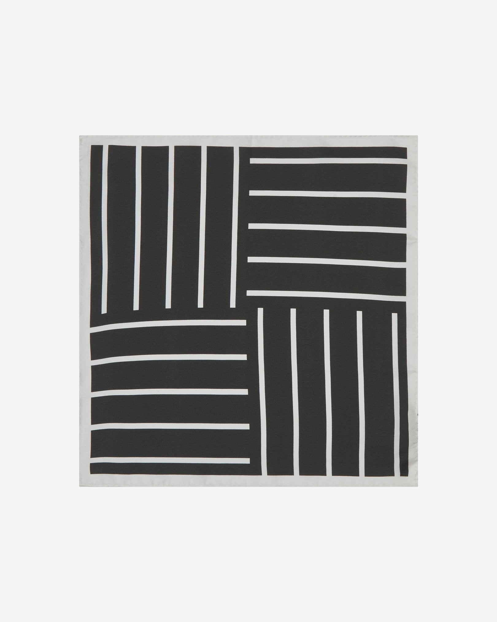 Completely unfolded silk pocket square showing the entirity of the striped monochrome patterns. Alternating white stripes at 90 degree intervals on a black background.