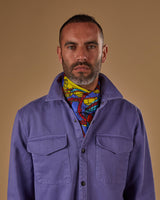 Top-half view of model wearing the Yellow BT Tower scarf.