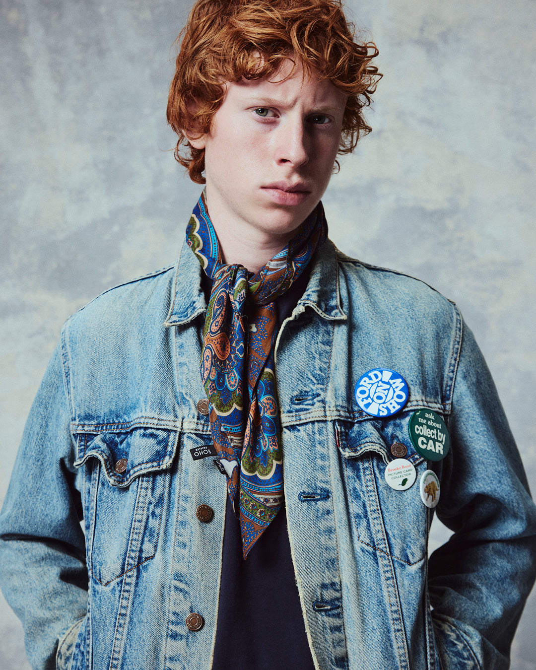 Close up of man wearing the 'The Montreal' multicoloured paisley patterned bandana. Tied snugly around neck in a simple tuck.