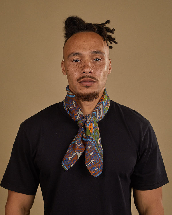 Wearing 'The Montreal' bandana from SOHO Scarves. Tied loosely around neck in a simple tuck and paired with a black t-shirt.