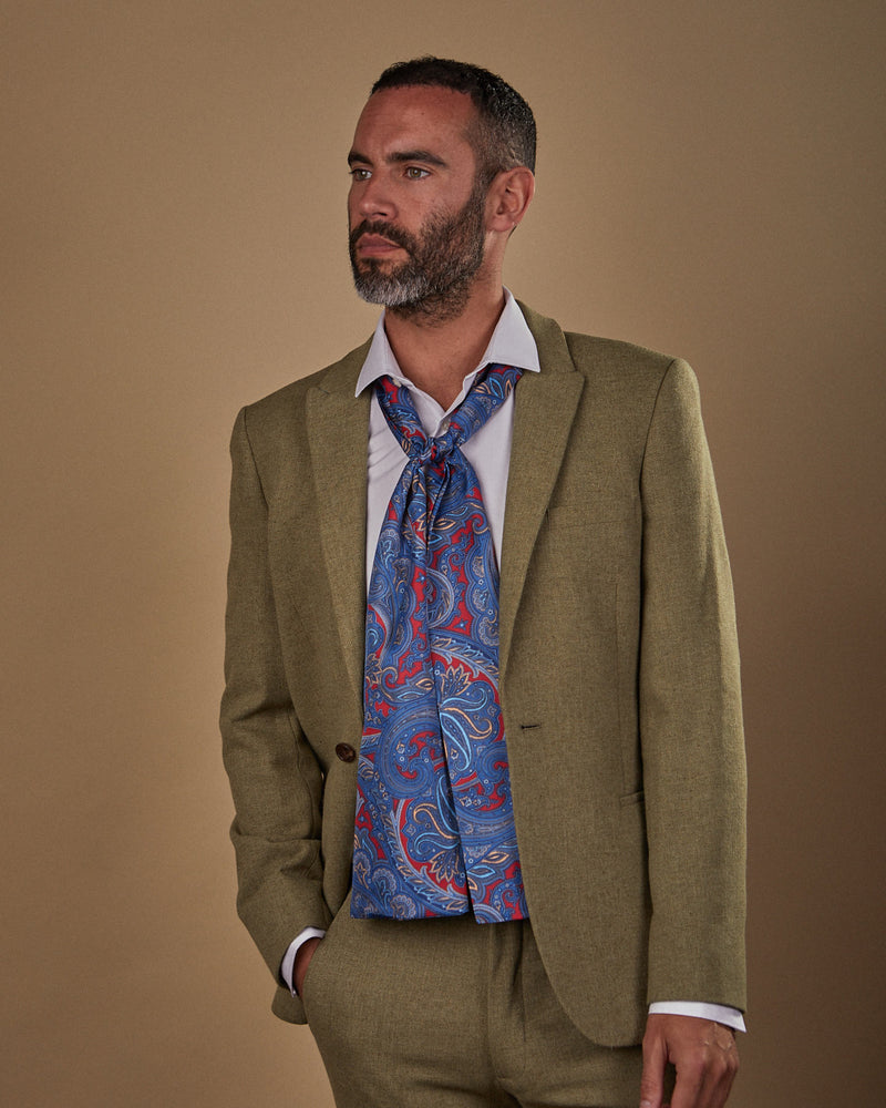 Slightly angled front view wearing an Oxford polyester scarf from SOHO Scarves, paired with pale blue shirt and sandy-green suit.