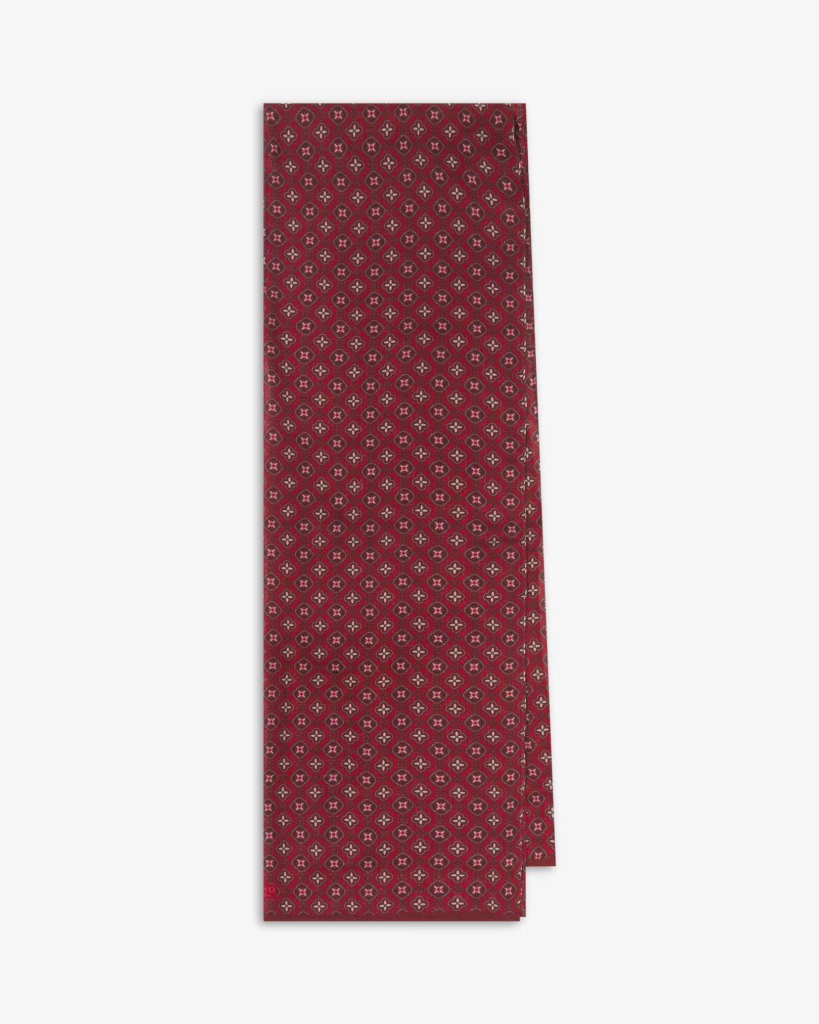 The Wenatchee 'Good Fortune' bohemian wide scarf folded and presented vertically to show the full dimensions and repeating floral and geometric pattern in varying shades of red with black and cream accents.