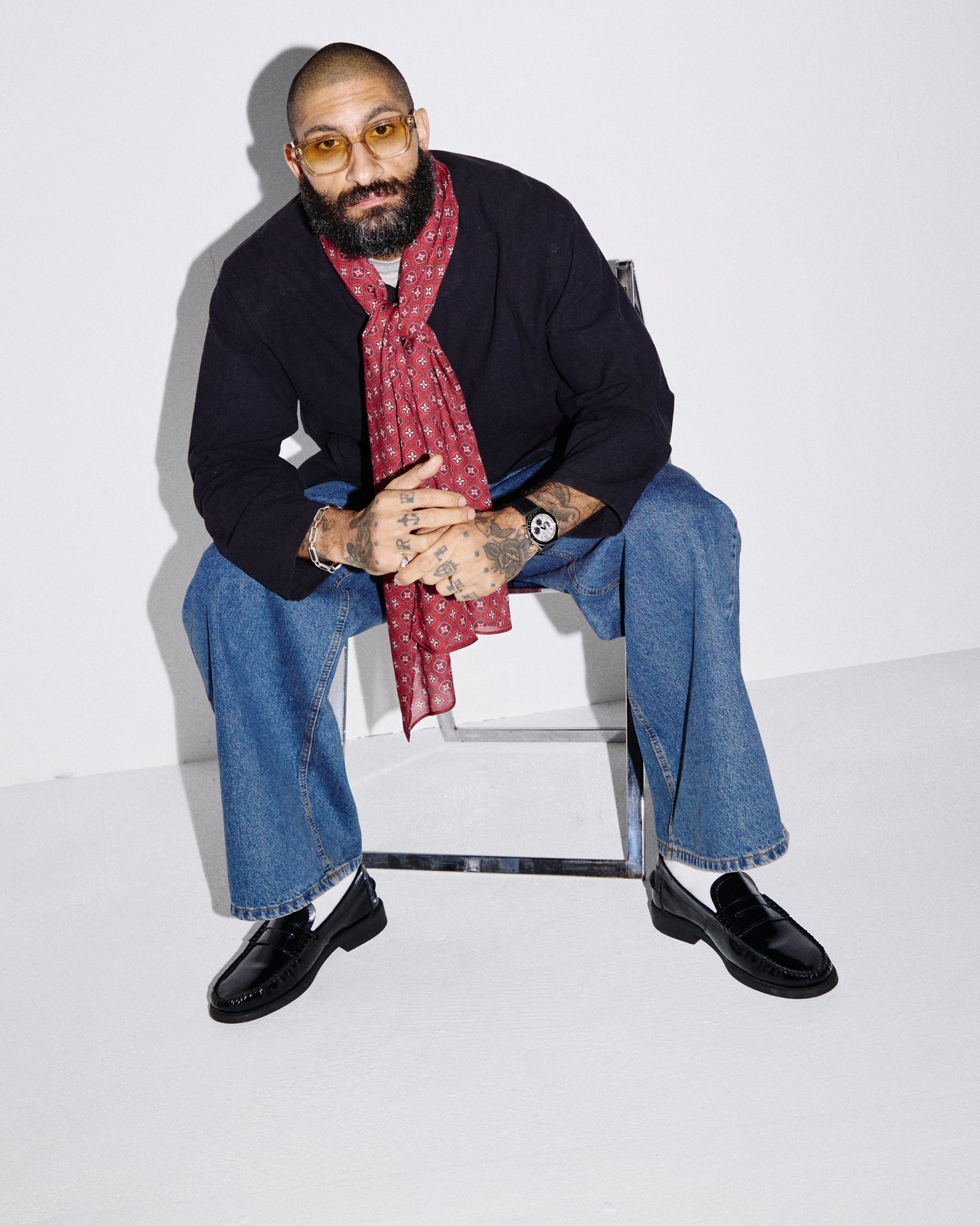 Seated model wearing the 'Good Fortune' Wenatchee Bohemian Lightweight Wide Scarf.