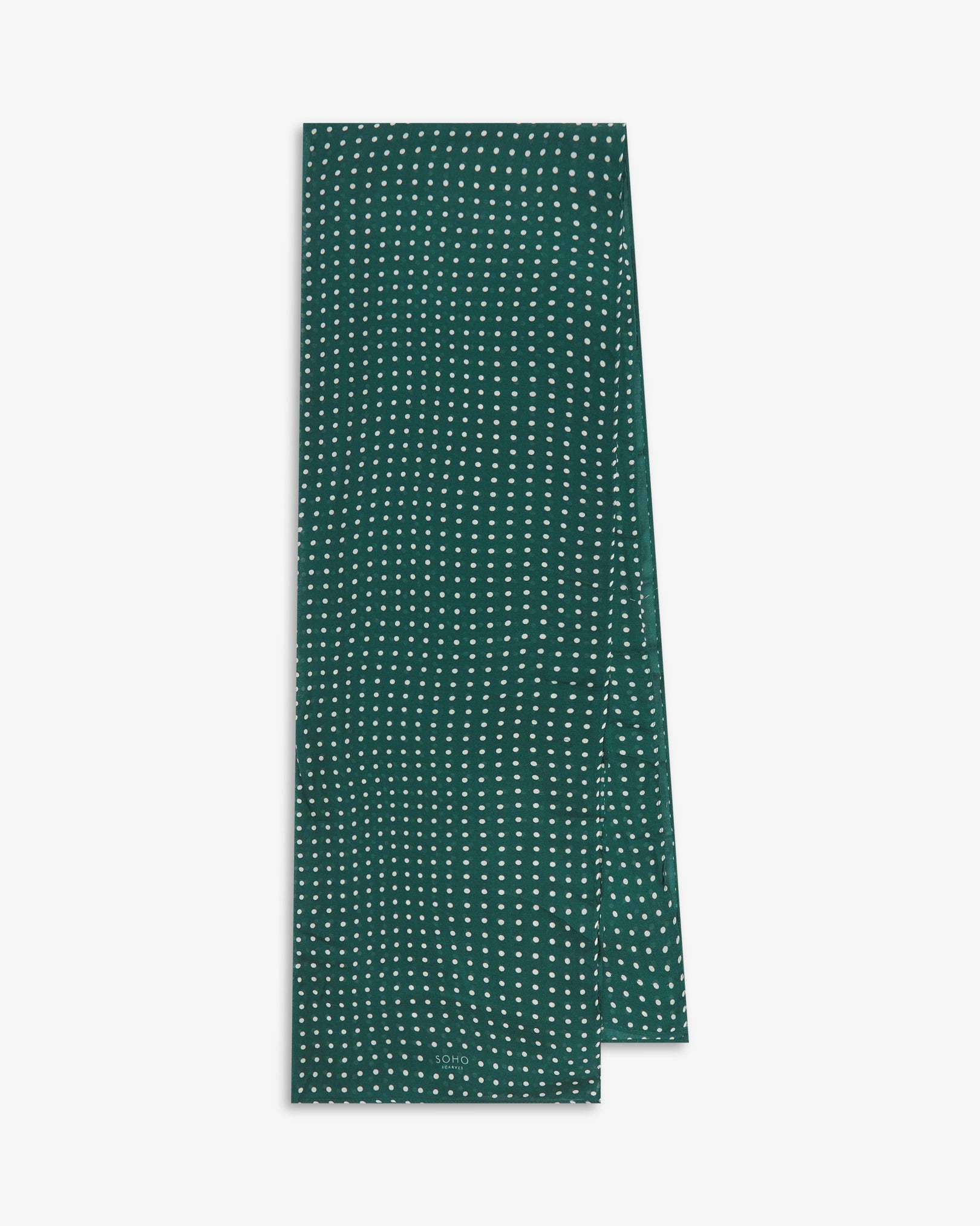 The Westminster RG bohemian wide scarf from SOHO Scarves folded and presented vertically to show the full dimensions and classic white polka dot pattern on a British racing green background.