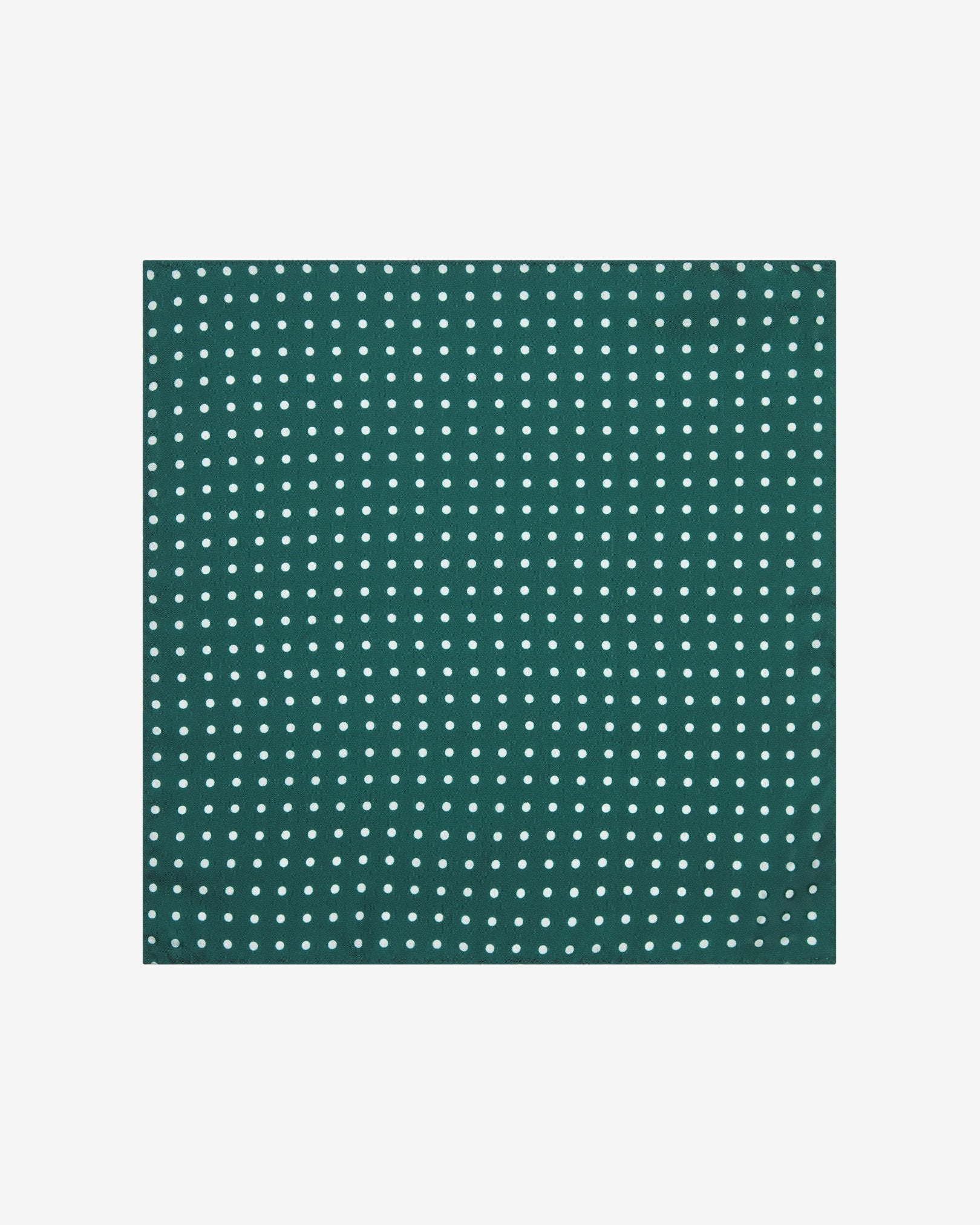 The 'Westminster Rg' silk pocket square from SOHO Scarves UK collection. Folded into a quarter, showing the white polka dots against a racing green background.