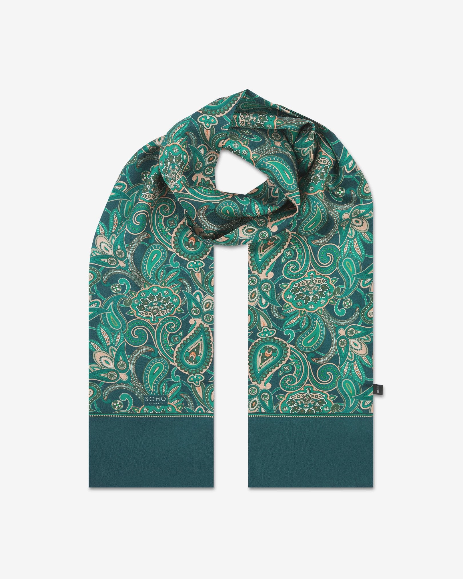 The 'Windermere' emerald-green silk scarf looped with both ends parallel to effectively display the full repeat pattern of green and salmon pink paisley patterns.