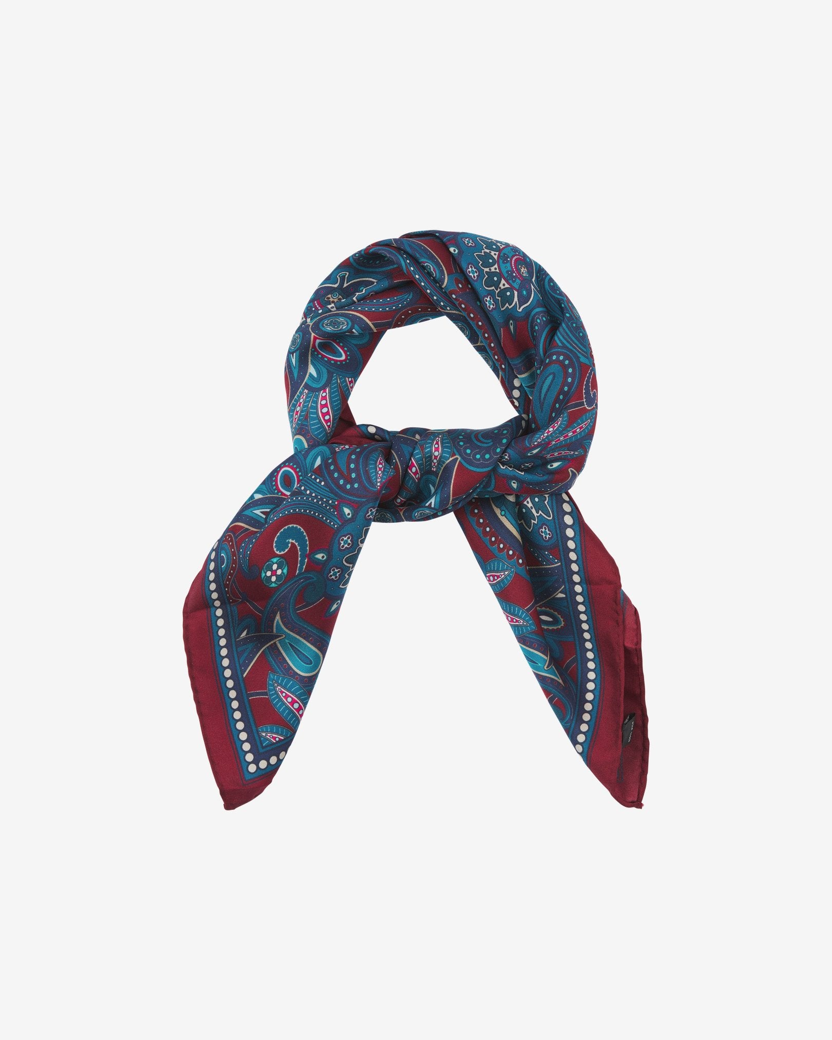 The 'Windermere' neckerchief looped and knotted, presenting the blue and blue-green paisley patterns against the sheen of the fine silk material.