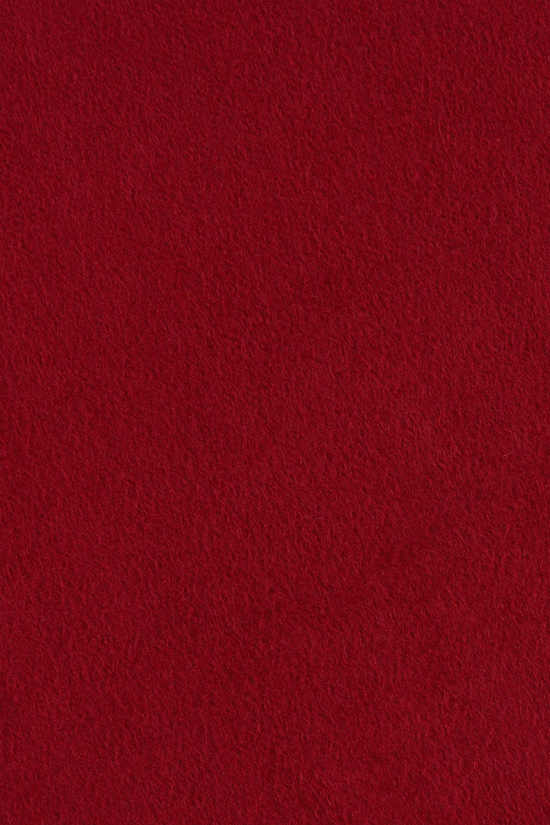 Close range view of red-maroon cashmere scarf from Soho Scarves, showing individual fibres and texture of soft material.