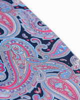 Angled view of the patterned scarf, focussing on the large multicoloured paisley decoration.