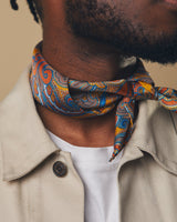 Portrait close-up view of model wearing  'The Carnaby' golden neckerchief tied in a simple knot.